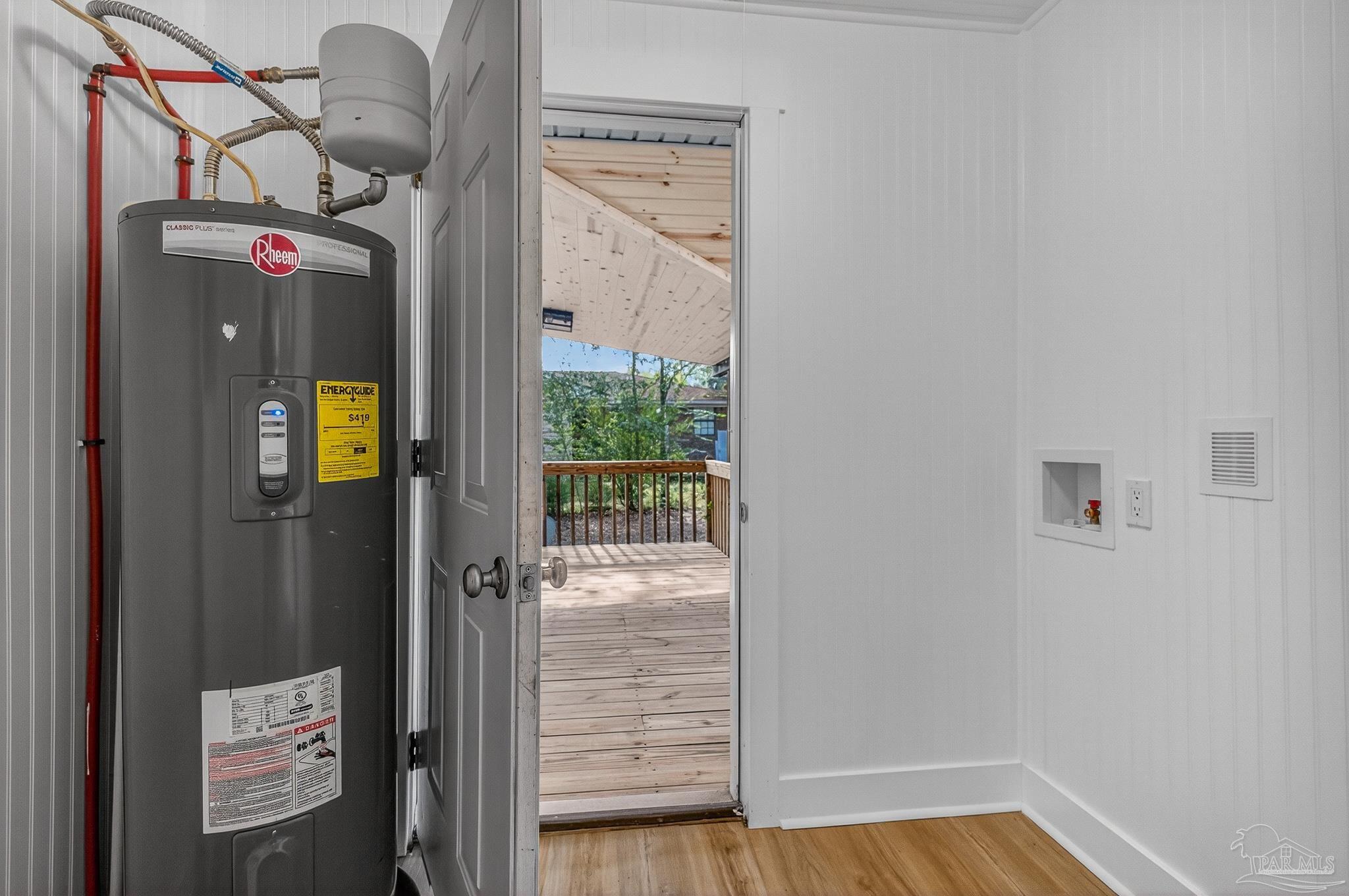 4771 Carl Booker Road Milton, FL 32583 - Photo 54 of 65 a view of a hallway with wooden floor