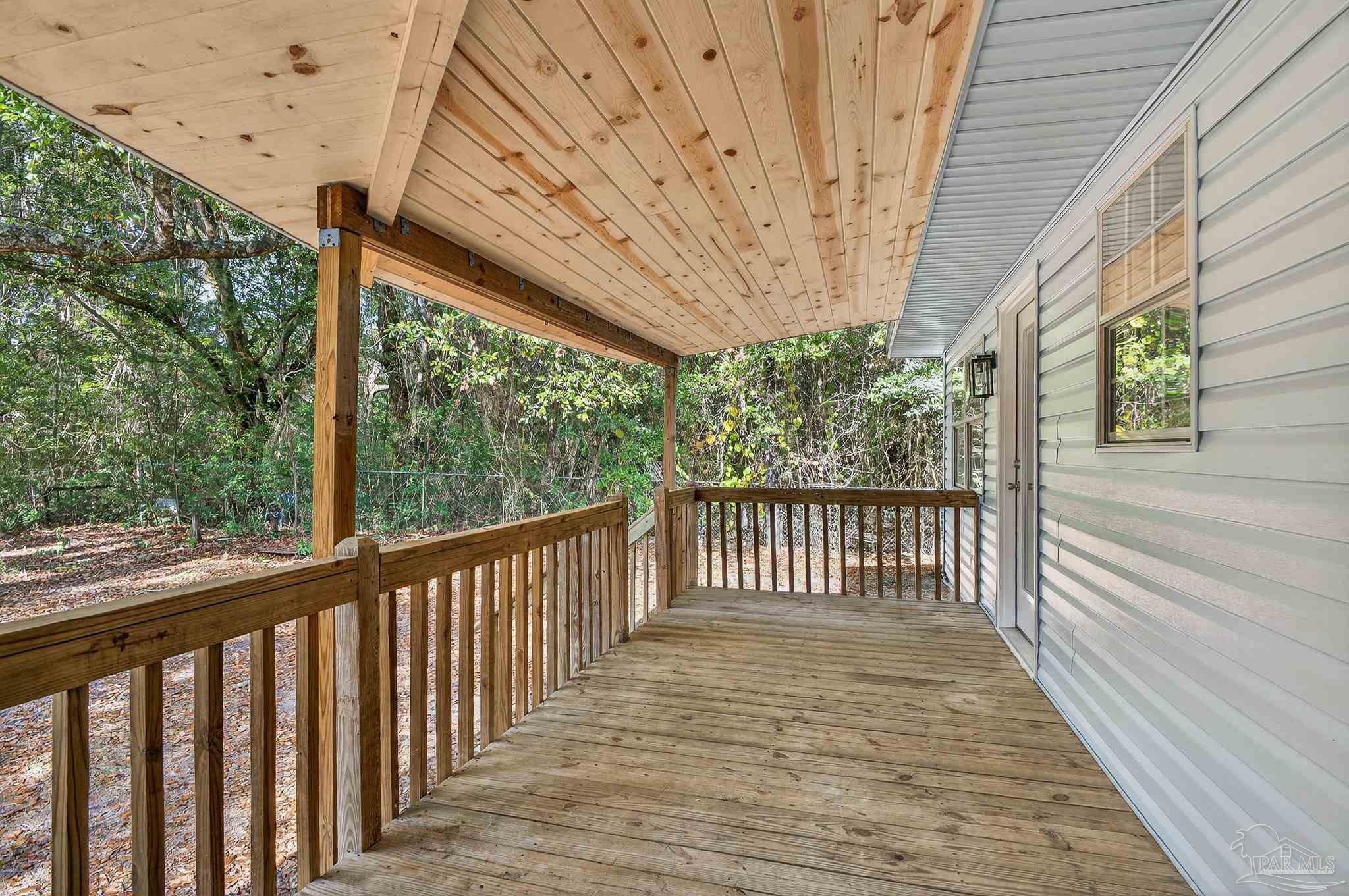4771 Carl Booker Road Milton, FL 32583 - Photo 57 of 65 a view of a room with wooden floor and iron stairs