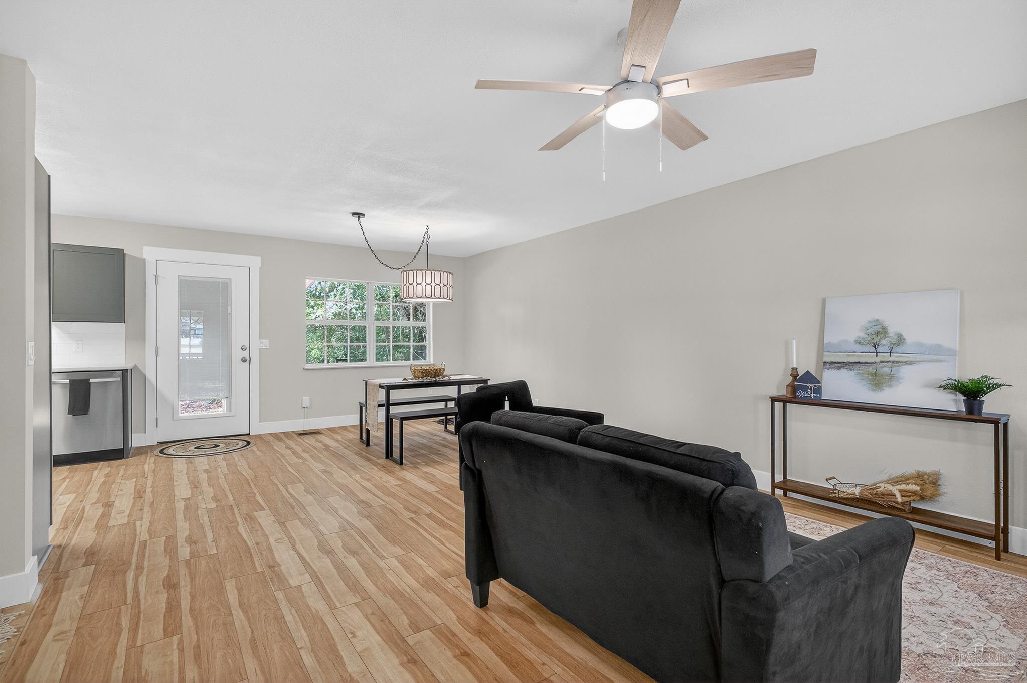 4771 Carl Booker Road Milton, FL 32583 - Photo 7 of 65 a living room with furniture and a window