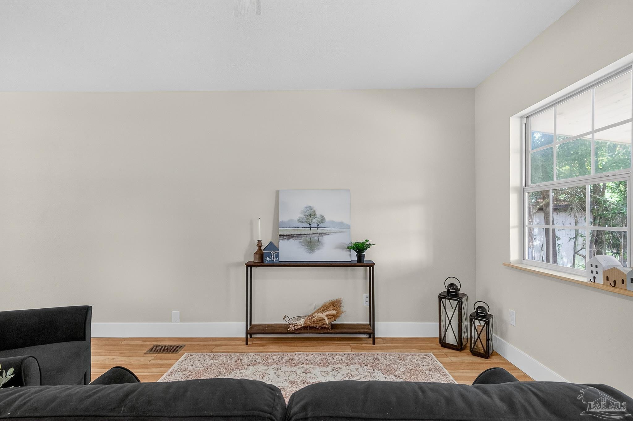 4771 Carl Booker Road Milton, FL 32583 - Photo 9 of 65 a living room with furniture and a window