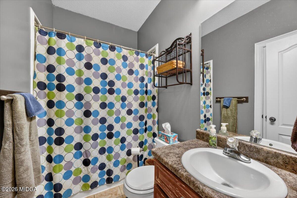 619 Grayridge Road Gray, GA 31032 - Photo 24 of 40 a bathroom with a sink toilet and shower