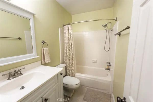 a bathroom with a sink toilet tub and shower