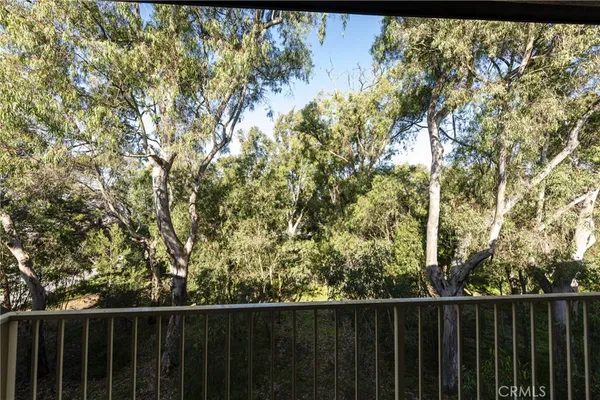 a balcony with wooden fence