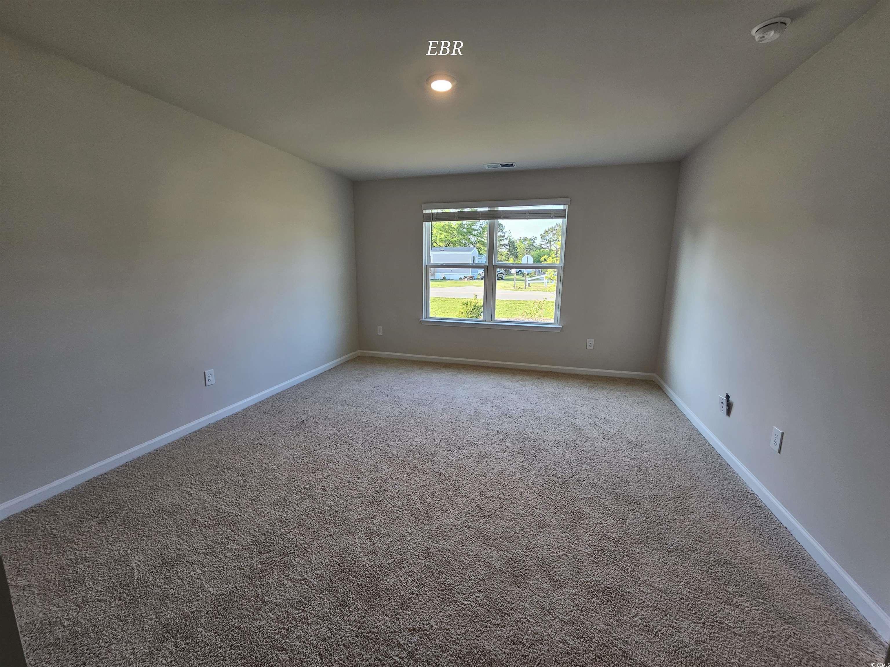370 Jeff Waters Circle Longs, SC 29568 - Photo 12 of 14 Carpeted spare room with baseboards and visible ve