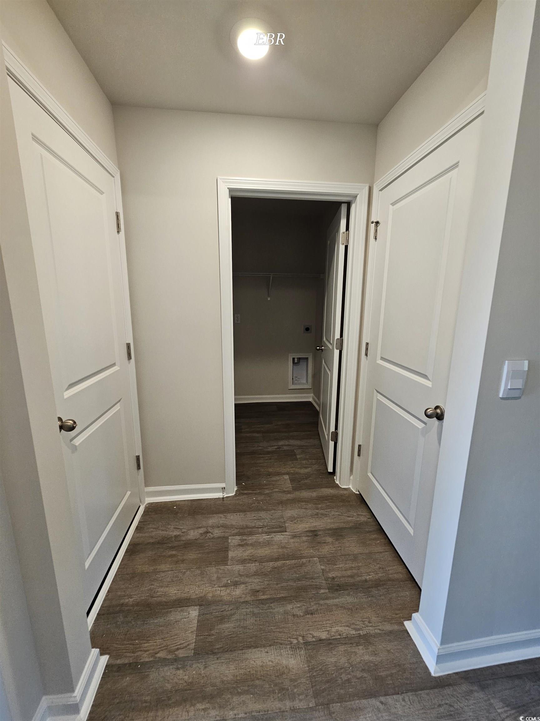 370 Jeff Waters Circle Longs, SC 29568 - Photo 13 of 14 Corridor with dark wood-type flooring and baseboar