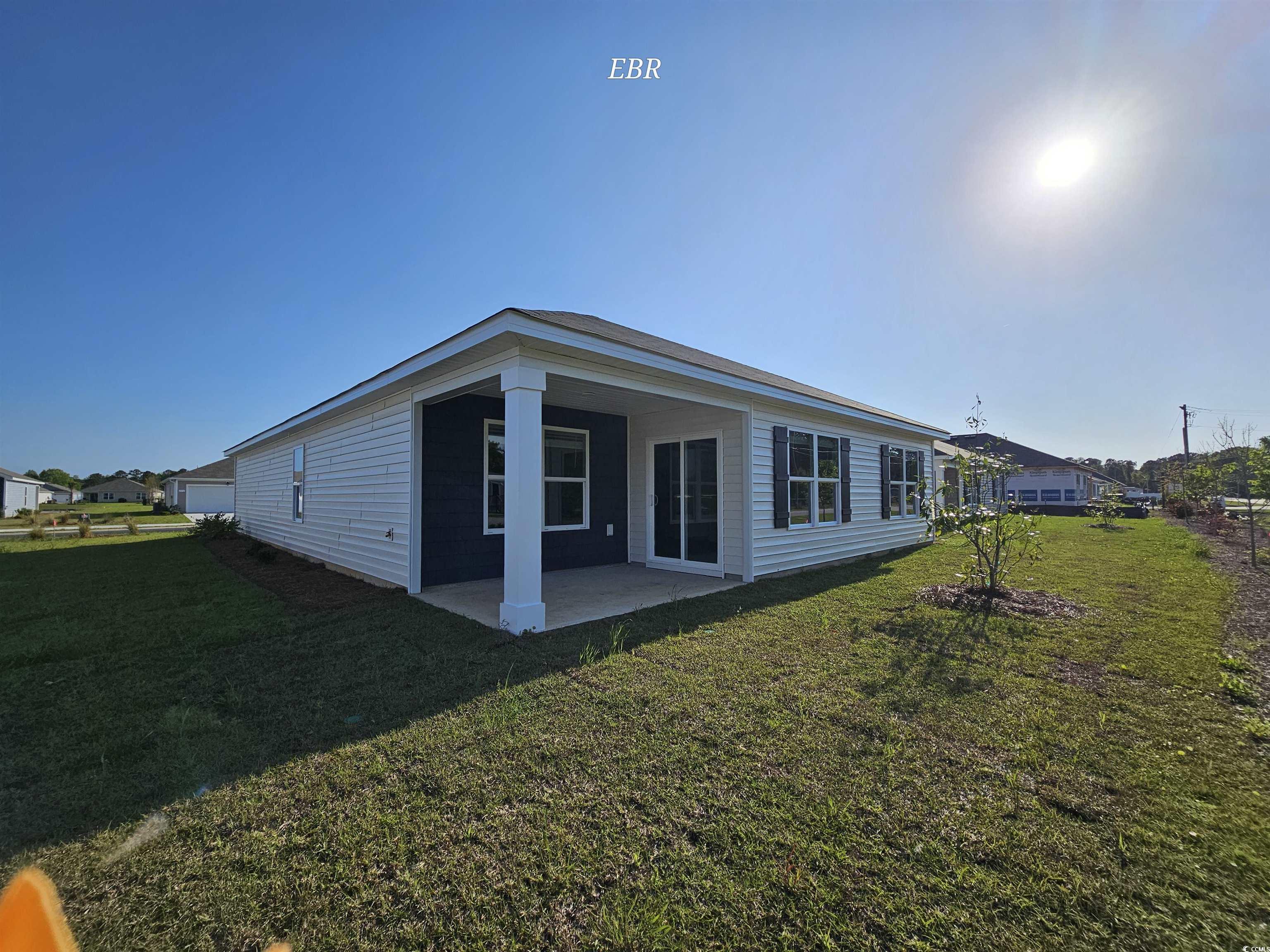 370 Jeff Waters Circle Longs, SC 29568 - Photo 2 of 14 Back of house featuring a yard and a patio