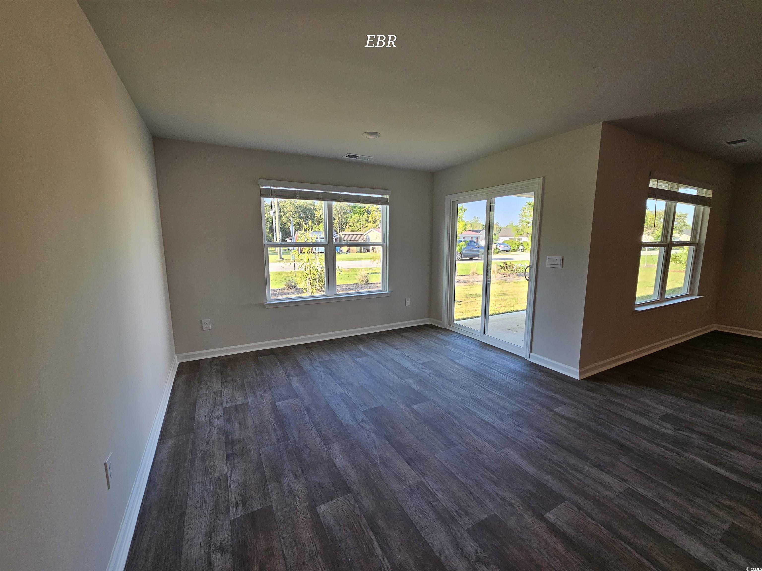 370 Jeff Waters Circle Longs, SC 29568 - Photo 8 of 14 Unfurnished living room featuring baseboards, visi