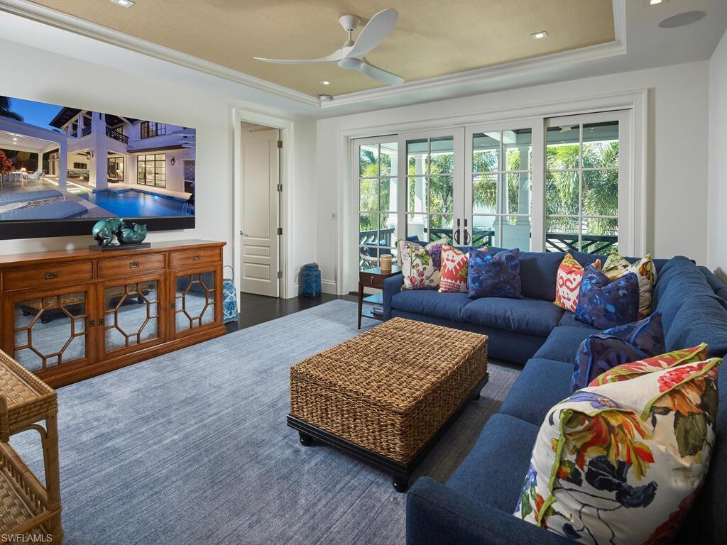 167 4th Street North Naples, FL 34102 - Photo 16 of 33 a living room with furniture and a flat screen tv