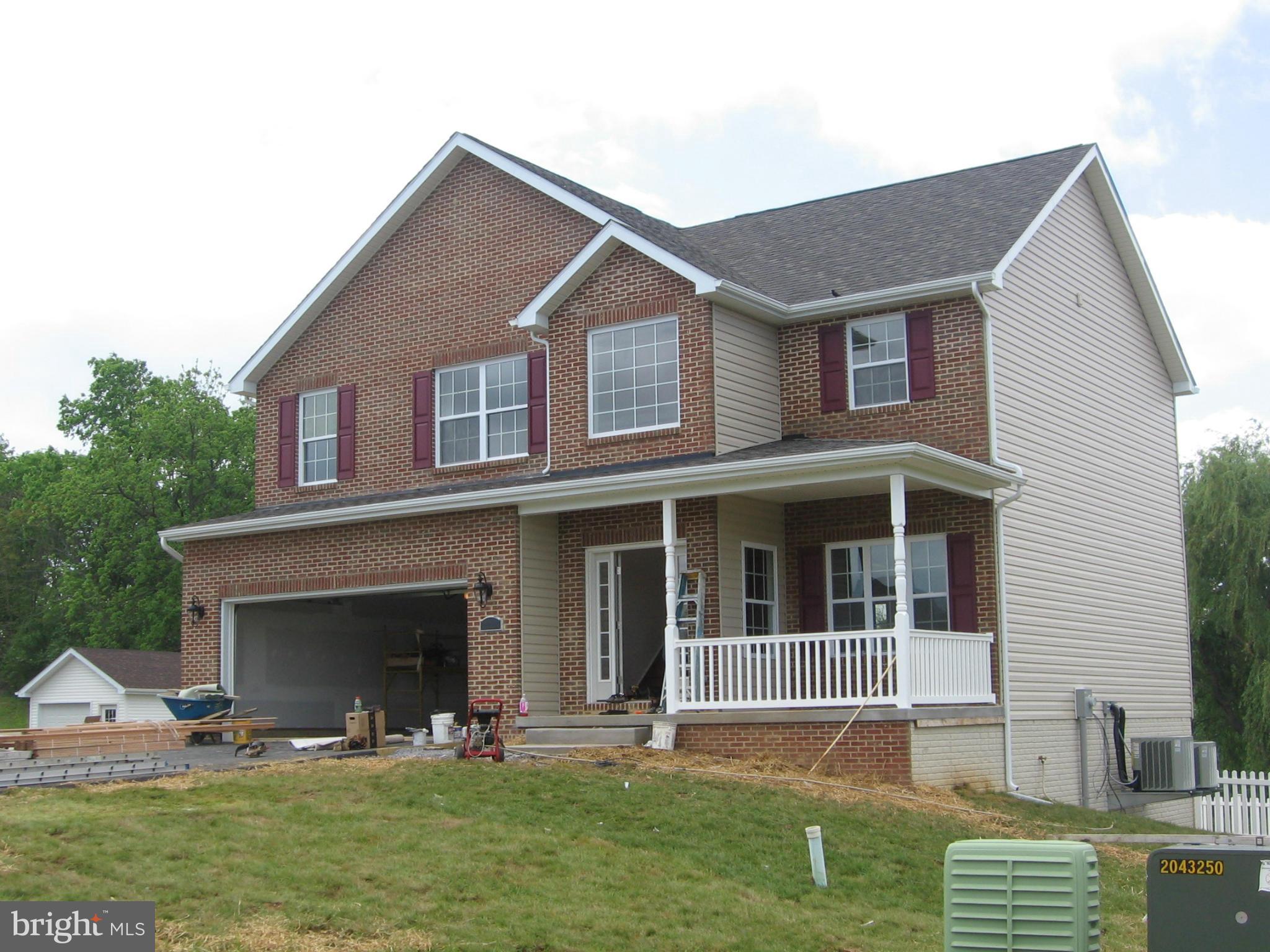 373 Boise Road Inwood, WV 25428 - Photo 1 of 7 a house view with a garden space