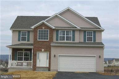 373 Boise Road Inwood, WV 25428 - Photo 6 of 7 a front view of a house with a yard and garage