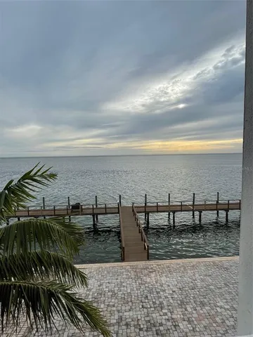 a reading room with furniture and a book shelf