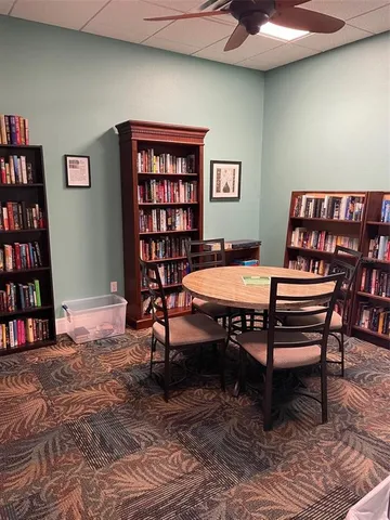 a view of a swimming pool and lounge chairs