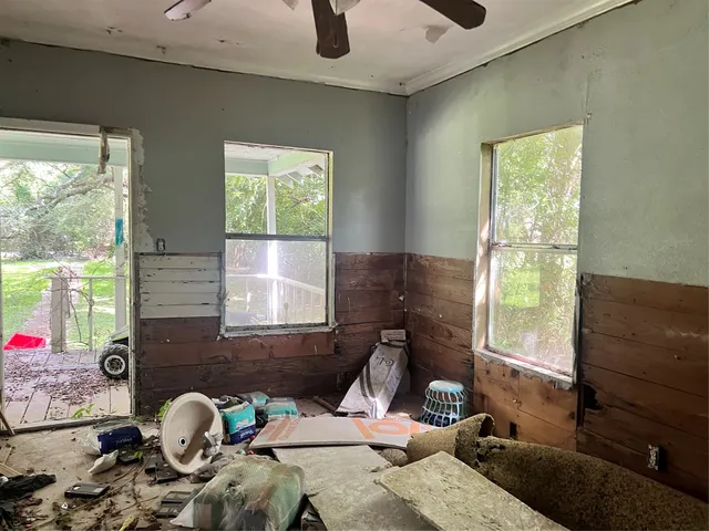 a living room with furniture and a window