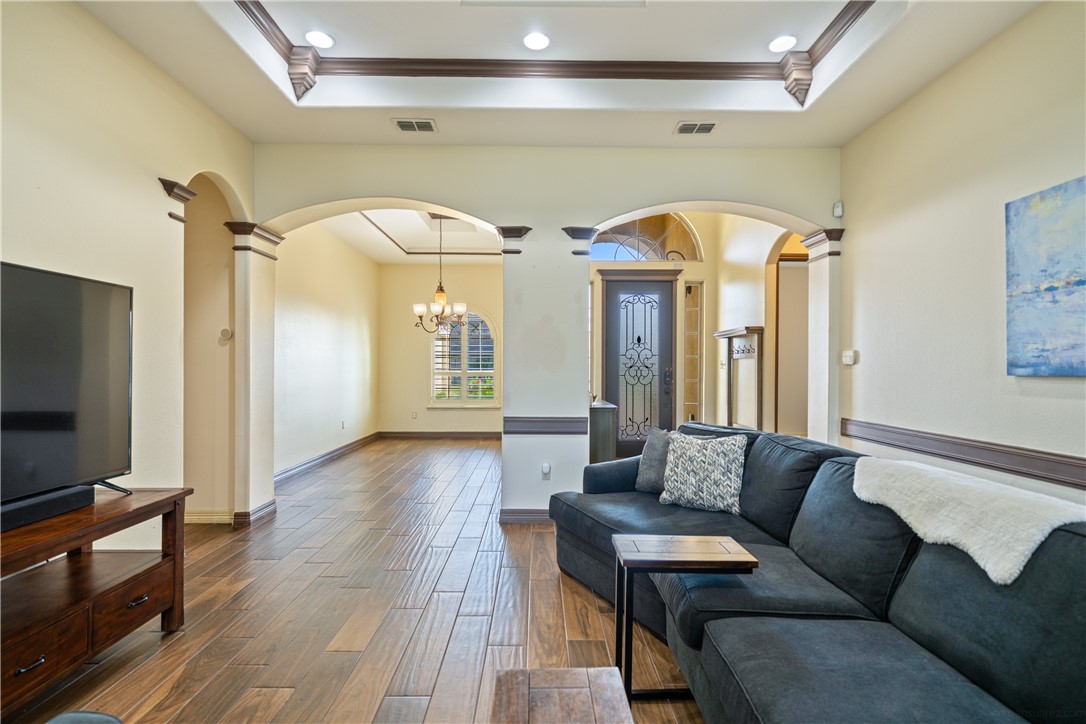 531 Pinehurst Portland, TX 78374 - Photo 12 of 36 a living room with couches and a flat screen tv with kitchen view