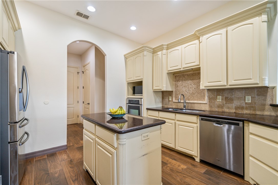 531 Pinehurst Portland, TX 78374 - Photo 15 of 36 a kitchen with stainless steel appliances granite countertop a sink stove and cabinets