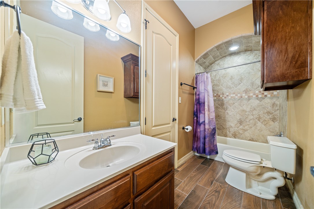 531 Pinehurst Portland, TX 78374 - Photo 18 of 36 a bathroom with a sink a toilet and shower