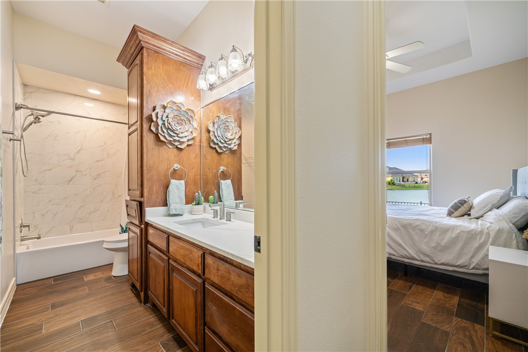 531 Pinehurst Portland, TX 78374 - Photo 27 of 36 a bathroom with a sink a mirror and a bathtub