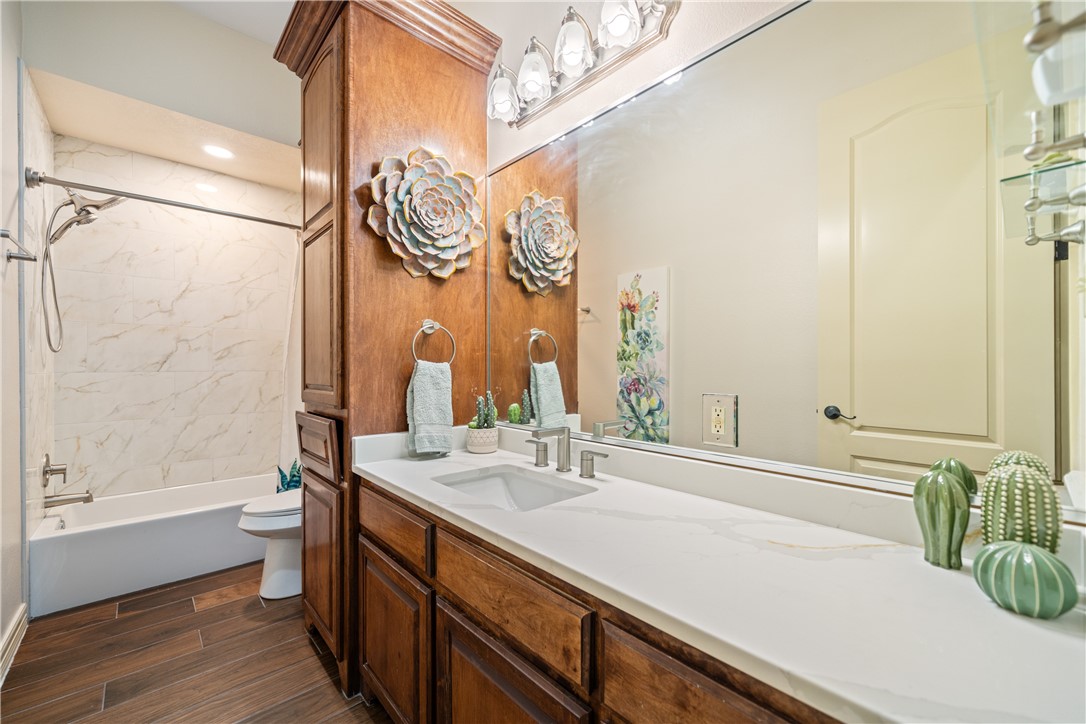 531 Pinehurst Portland, TX 78374 - Photo 28 of 36 a bathroom with a double vanity sink and a mirror