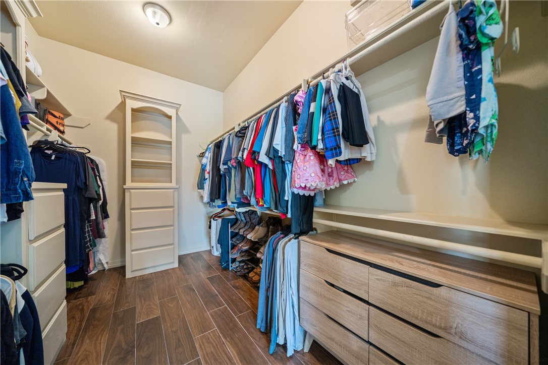 531 Pinehurst Portland, TX 78374 - Photo 33 of 36 a view of walk in closet with clothes and shoes