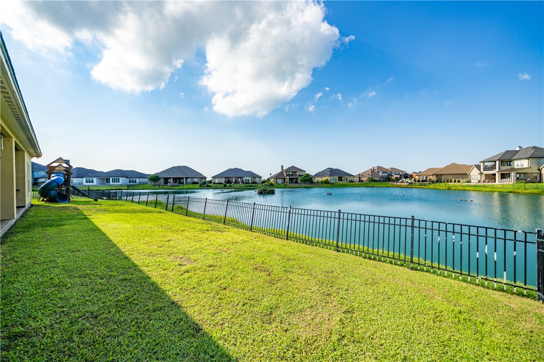 531 Pinehurst Portland, TX 78374 - Photo 5 of 36 a view of a swimming pool and trees in the background
