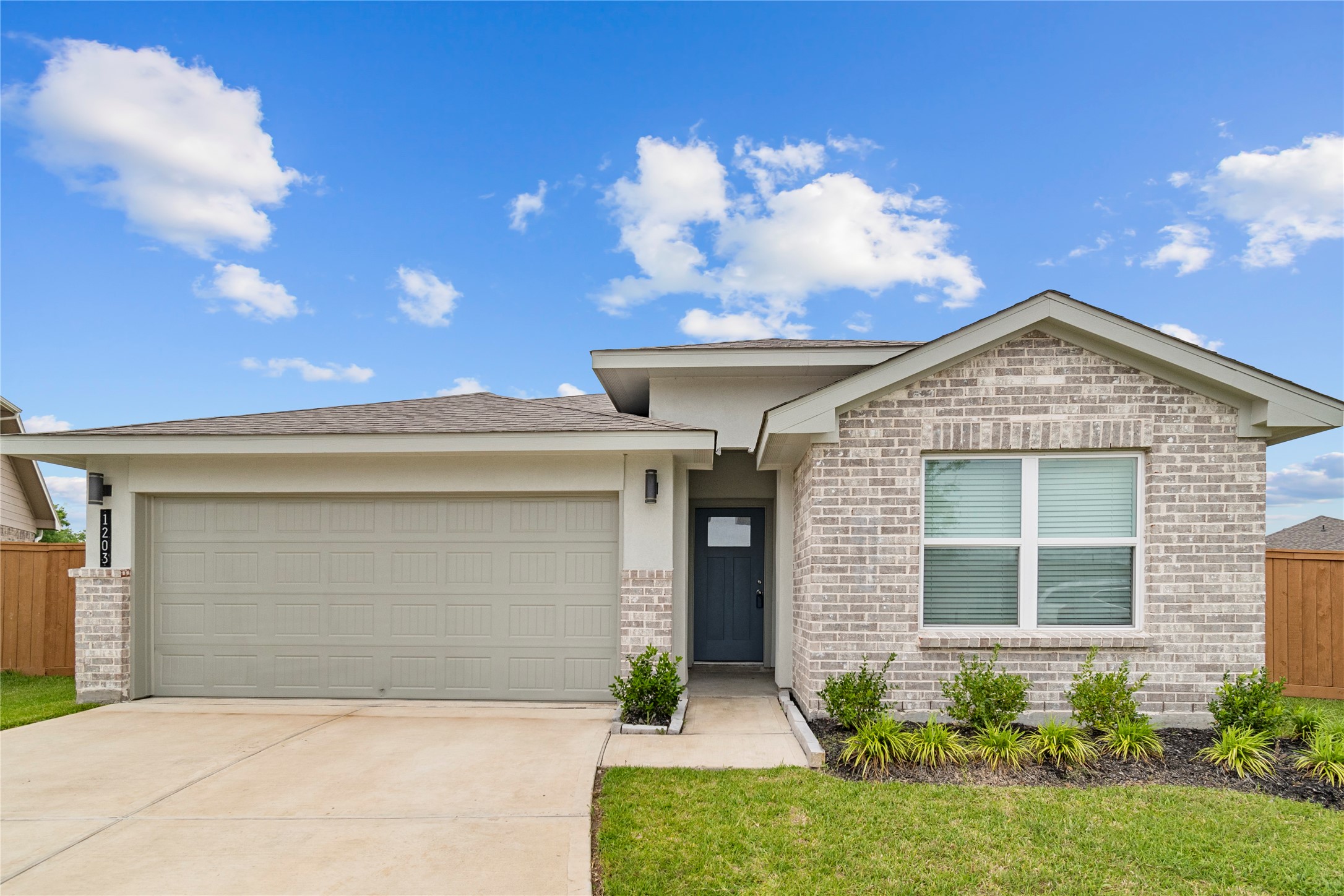 1203 Truckee River Drive Rosharon, TX 77583 - Photo 1 of 12 a front view of a house with garden