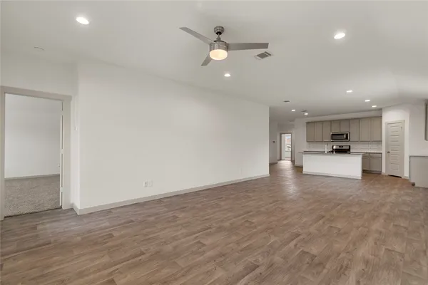 a view of kitchen with wooden floor and window