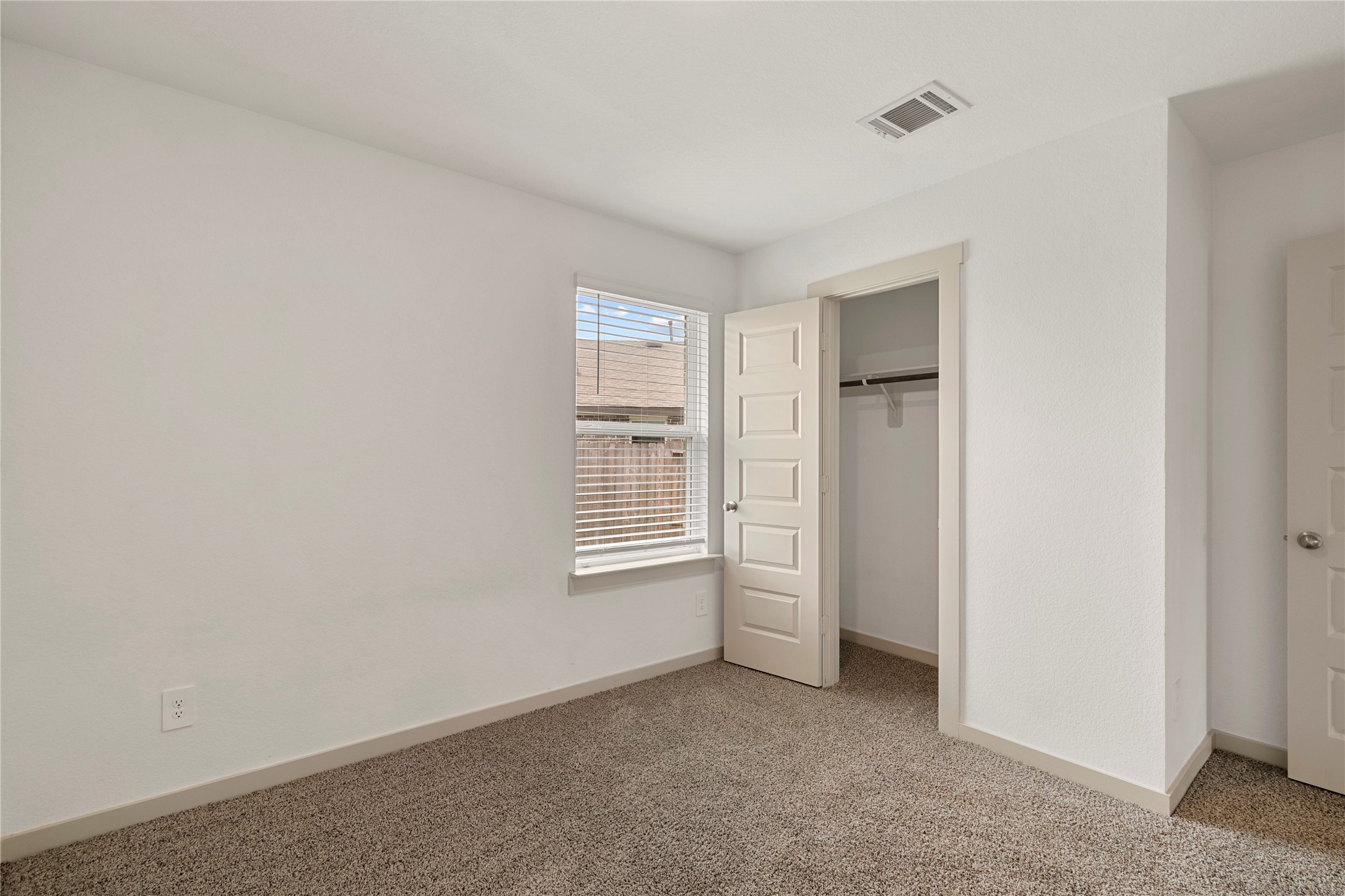 1203 Truckee River Drive Rosharon, TX 77583 - Photo 8 of 12 an empty room with windows