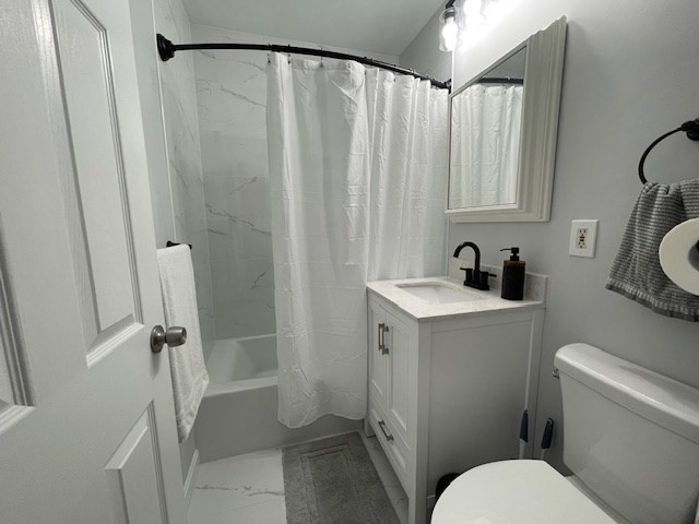 125 Farragut Road, Unit 46 Boston, MA 02127 - Photo 4 of 15 a bathroom with a sink a toilet and shower