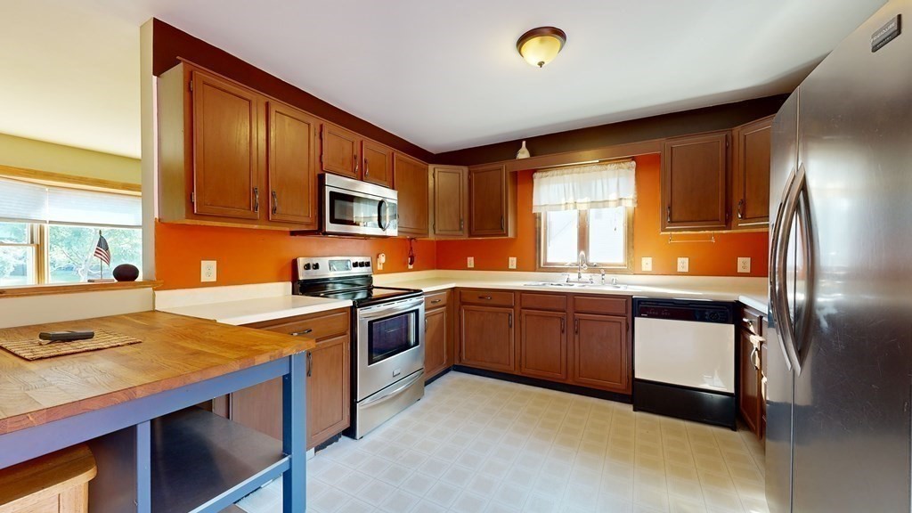 17 Mohave Road Worcester, MA 01606 - Photo 13 of 34 a kitchen with granite countertop stainless steel appliances and wooden cabinets