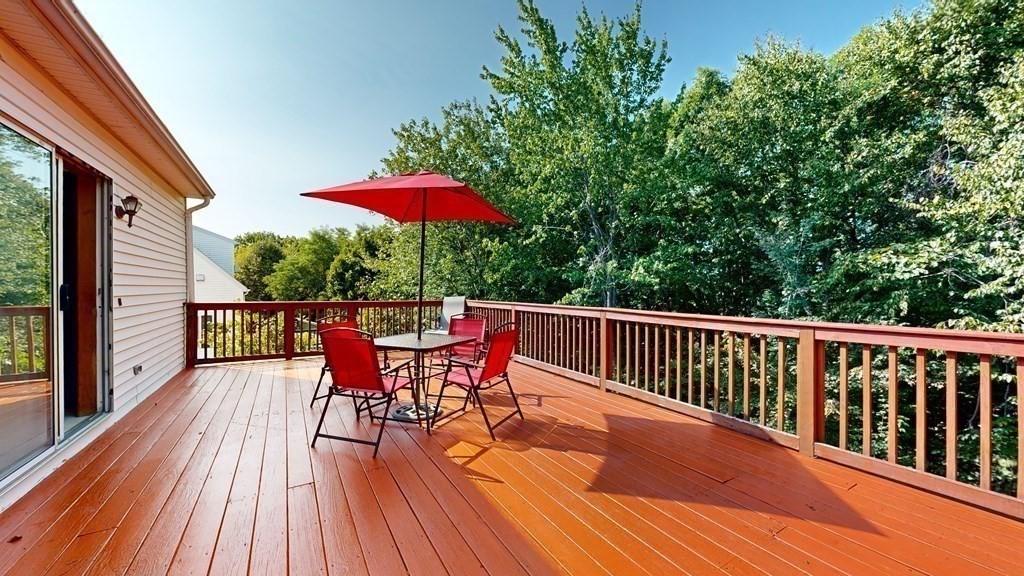 17 Mohave Road Worcester, MA 01606 - Photo 17 of 34 a balcony with wooden floor table and chairs