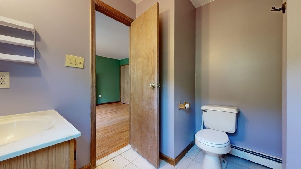 17 Mohave Road Worcester, MA 01606 - Photo 21 of 34 a bathroom with a granite countertop toilet and a sink