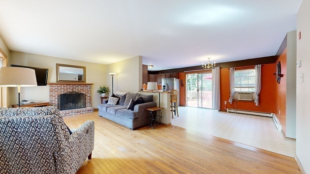 17 Mohave Road Worcester, MA 01606 - Photo 8 of 34 a living room with furniture large window and a fireplace