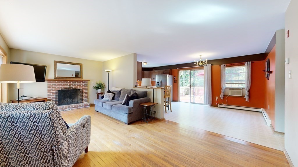 17 Mohave Road Worcester, MA 01606 - Photo 9 of 34 a living room with furniture large window and a fireplace