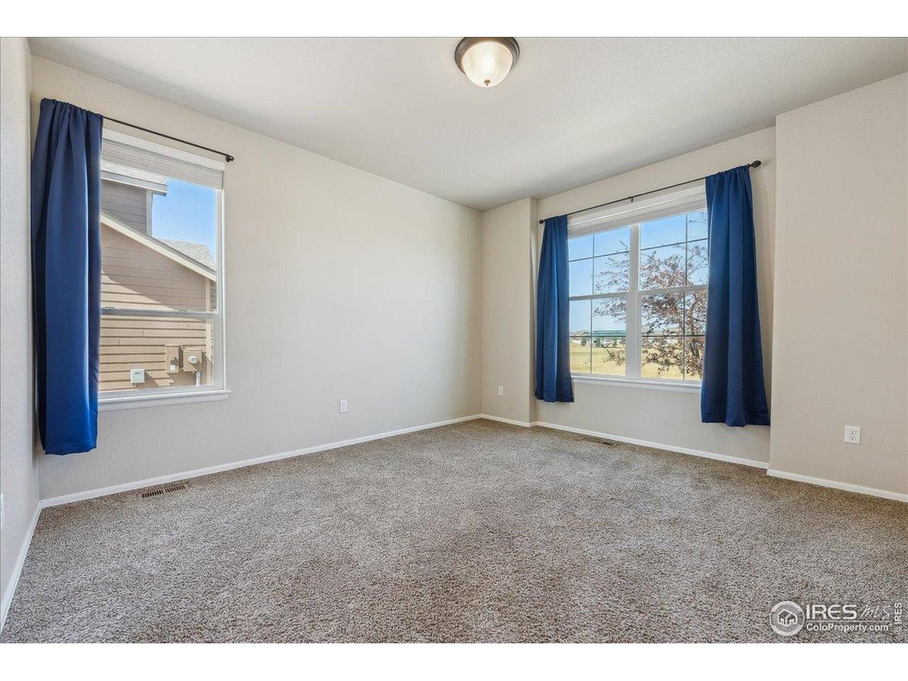 623 Gore Range Drive Severance, CO 80550 - Photo 11 of 36 a view of an empty room with a window