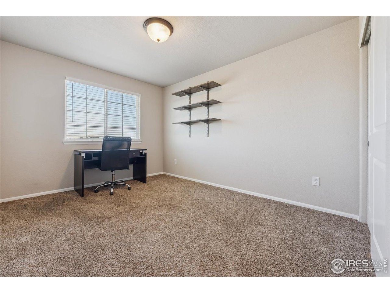623 Gore Range Drive Severance, CO 80550 - Photo 23 of 36 a view of workspace with a window