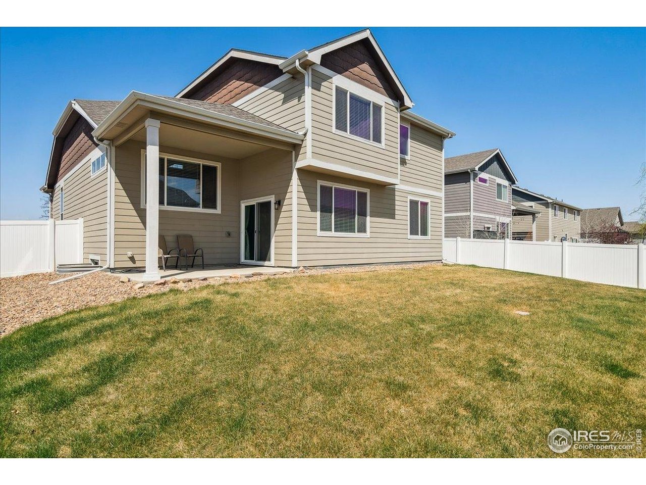 623 Gore Range Drive Severance, CO 80550 - Photo 34 of 36 a front view of a house with a garden