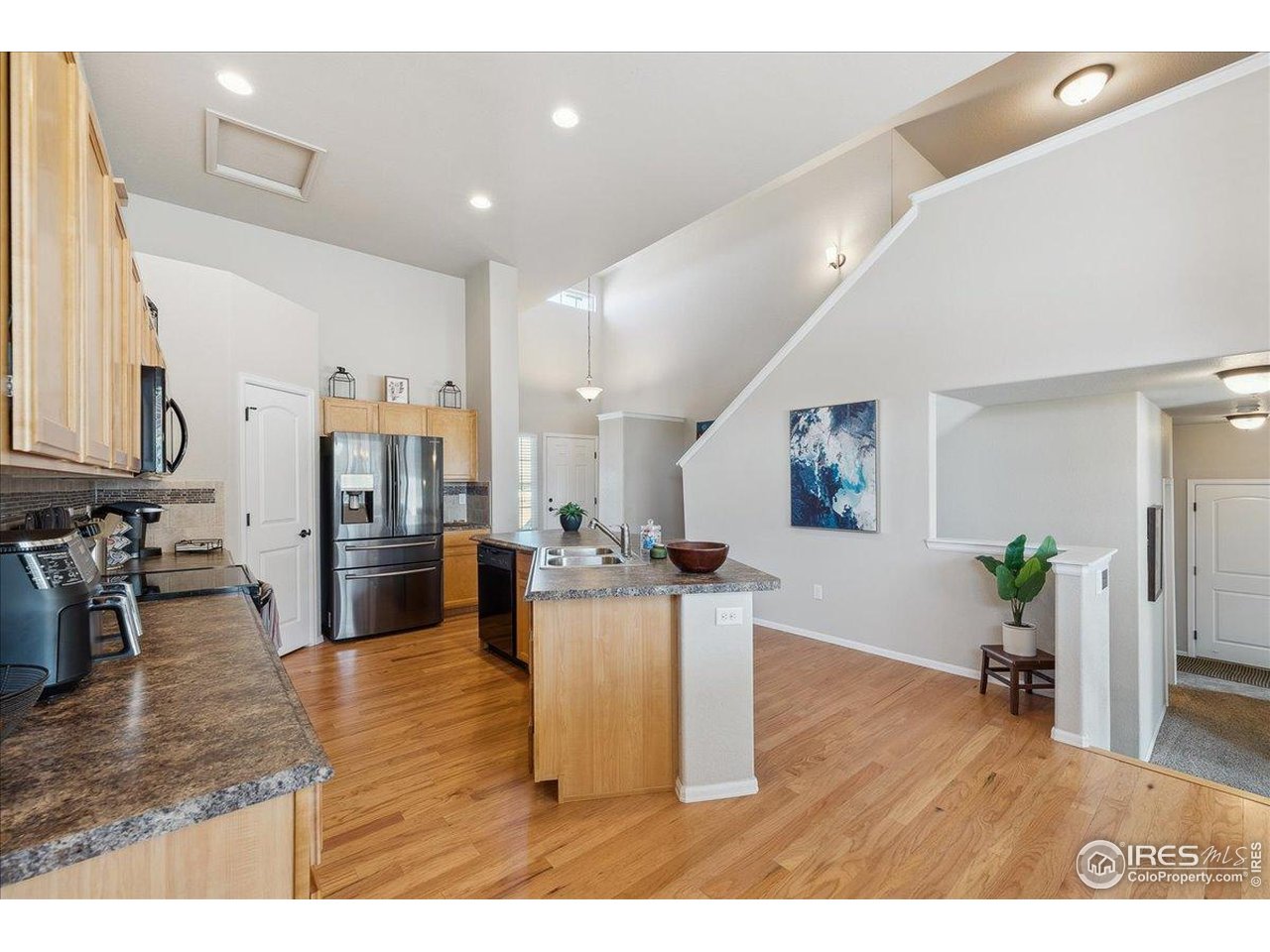 623 Gore Range Drive Severance, CO 80550 - Photo 8 of 36 a living room with furniture and wooden floor