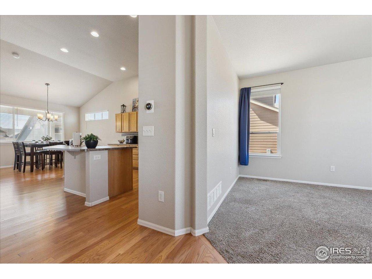 623 Gore Range Drive Severance, CO 80550 - Photo 10 of 36 a view interior of a house and kitchen view with wooden floor