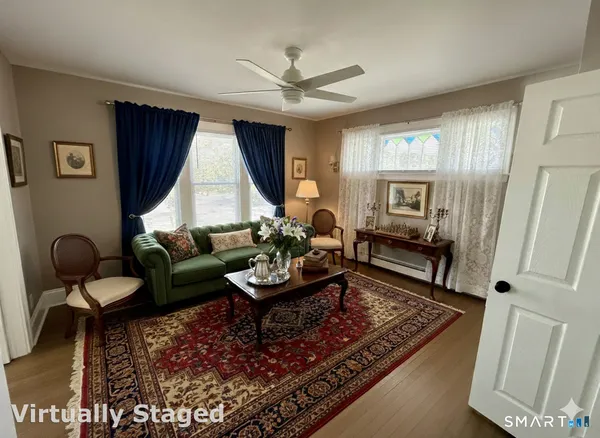 a living room with furniture and a window