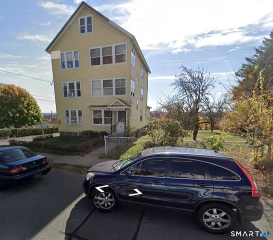 a car parked in front of a house