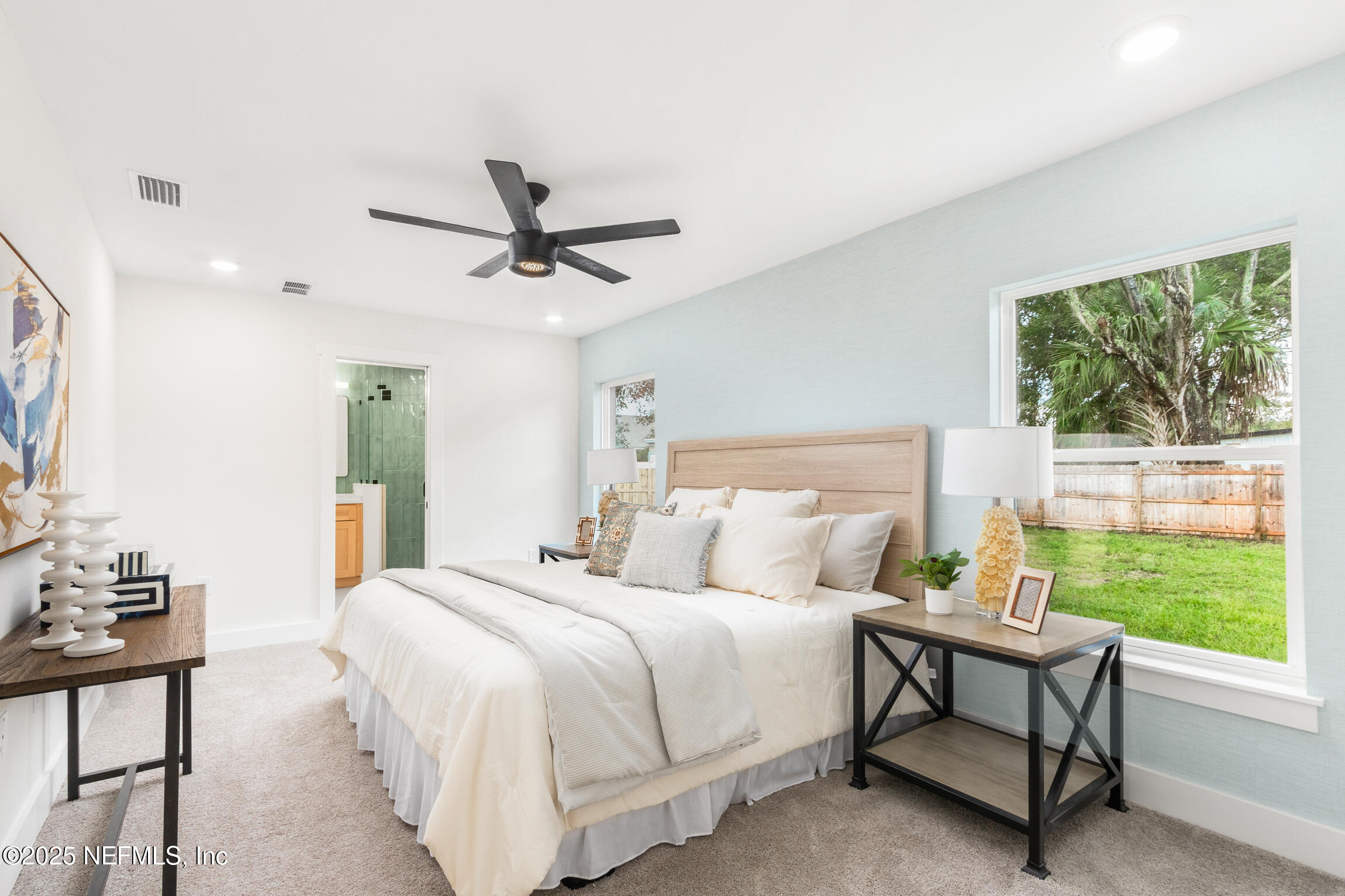 1746 Penman Road Jacksonville Beach, FL 32250 - Photo 21 of 40 a bedroom with a bed a couch and a window