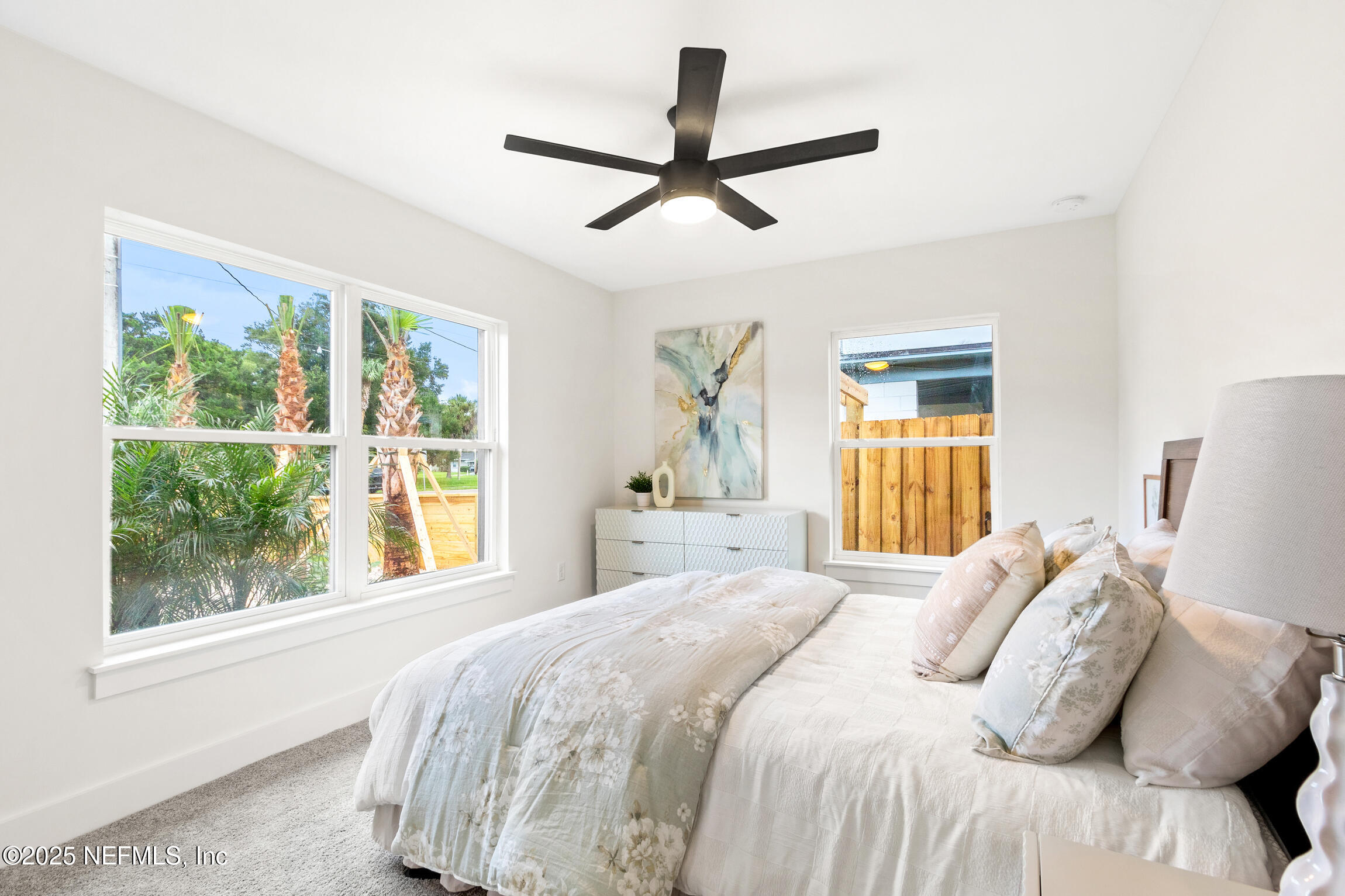 1746 Penman Road Jacksonville Beach, FL 32250 - Photo 29 of 40 a bedroom with a bed and a large window