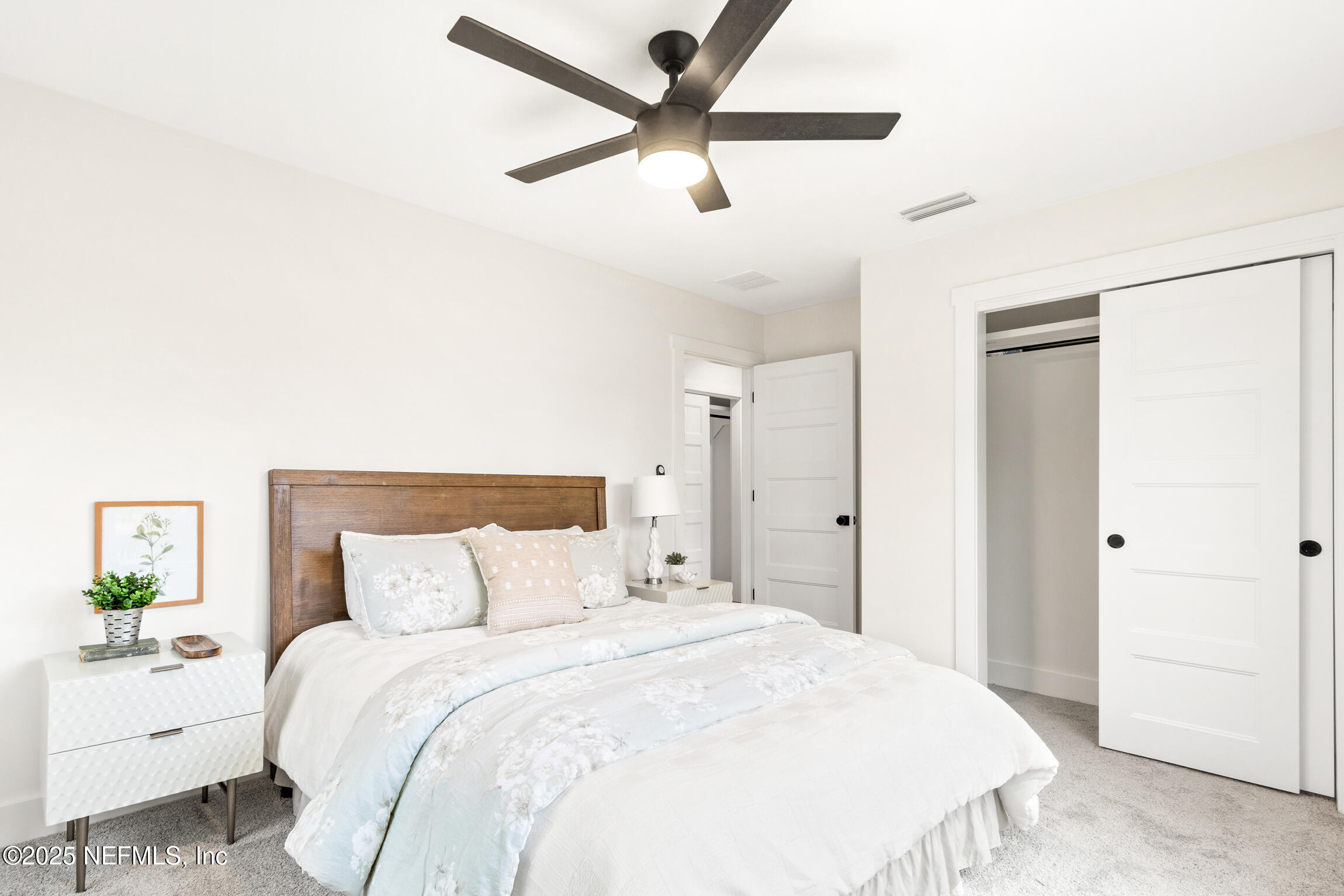1746 Penman Road Jacksonville Beach, FL 32250 - Photo 30 of 40 a bedroom with a bed and a painting on the wall