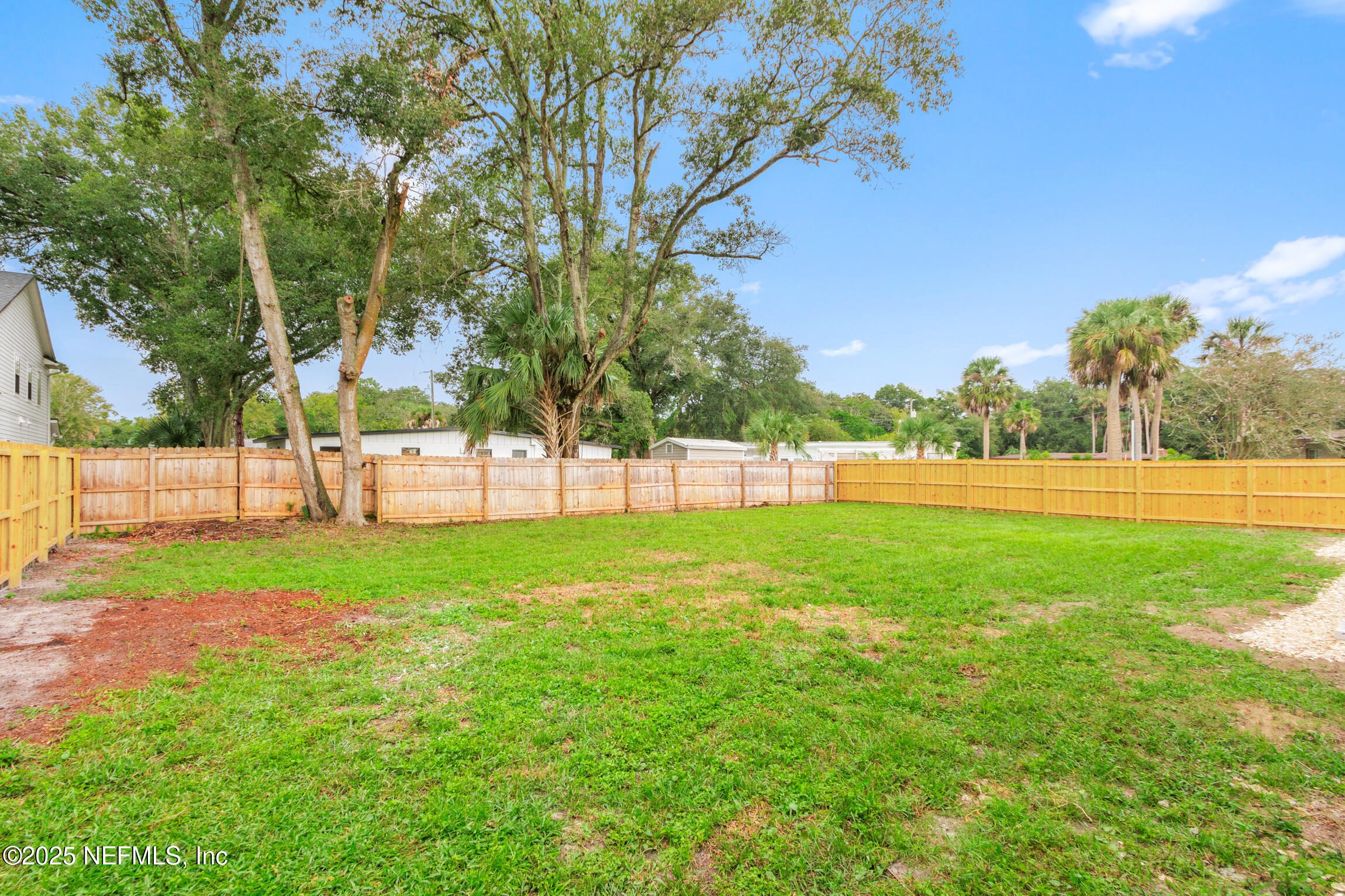 1746 Penman Road Jacksonville Beach, FL 32250 - Photo 37 of 40 a view of green field with trees around