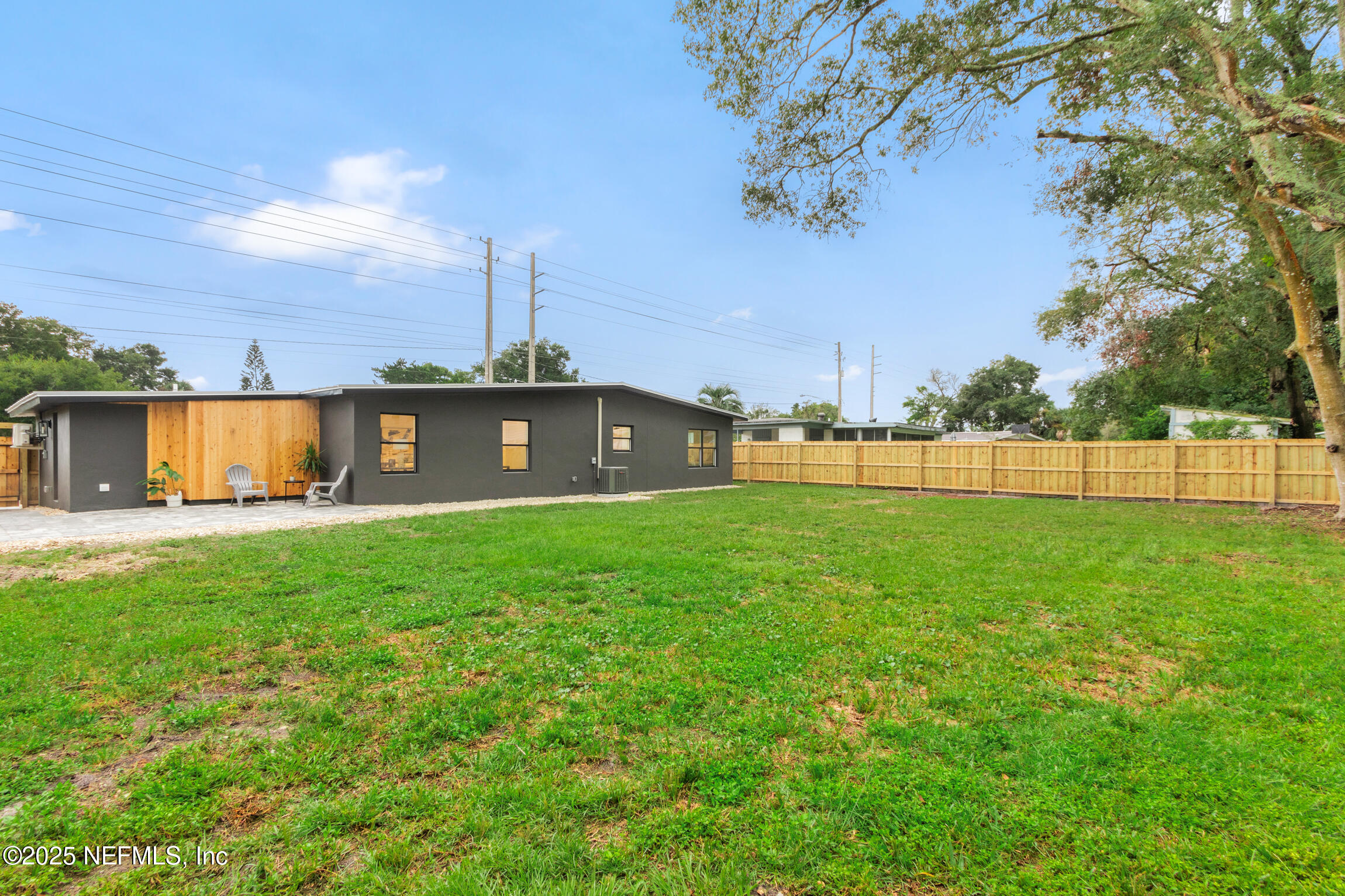 1746 Penman Road Jacksonville Beach, FL 32250 - Photo 39 of 40 a view of outdoor space with a garden and trees