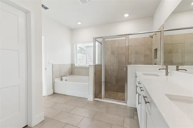 a view of cabinets and utility room with closet