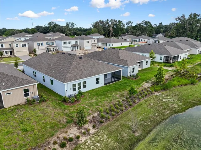 an aerial view of a house with a garden