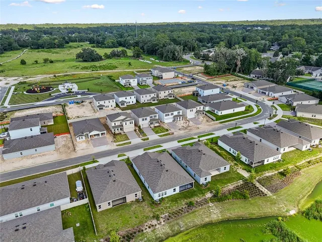 a view of a swimming pool with a yard