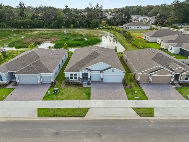 a aerial view of a house with big yard