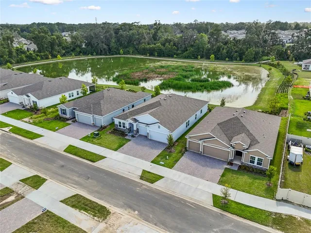 an aerial view of a house with outdoor space